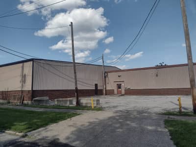 Commercial warehouse building with gray metal exterior.